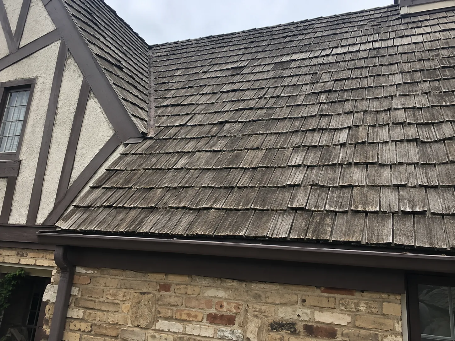 Cedar shake roof detail on a Tudor-style Milwaukee home