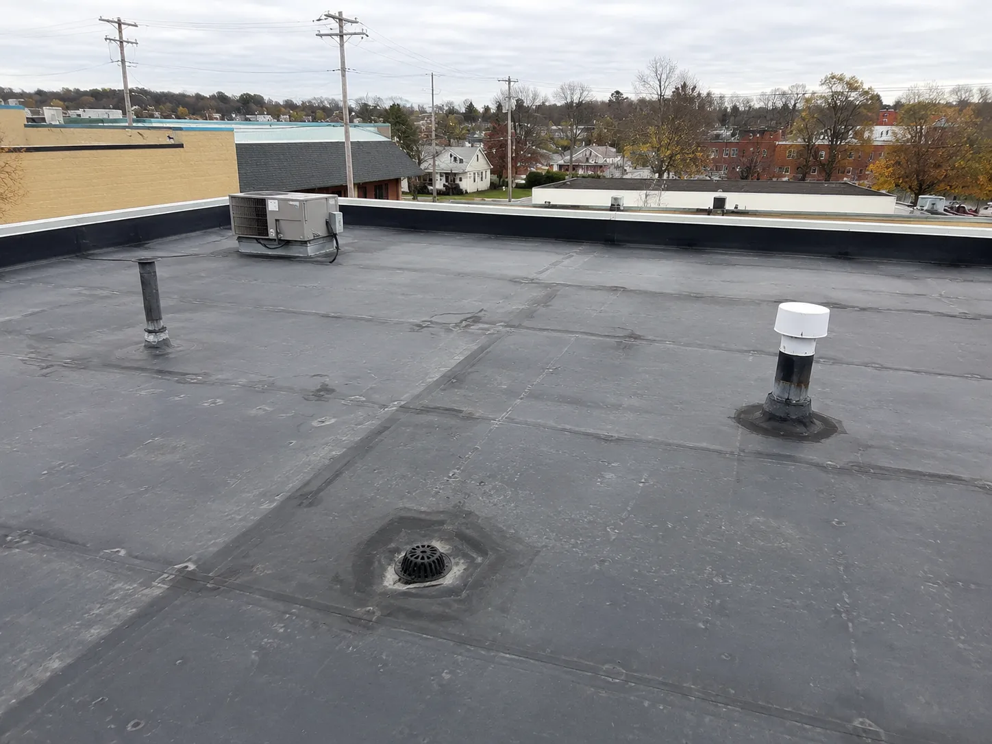 Flat roof membrane and drain inspection on a Milwaukee commercial building