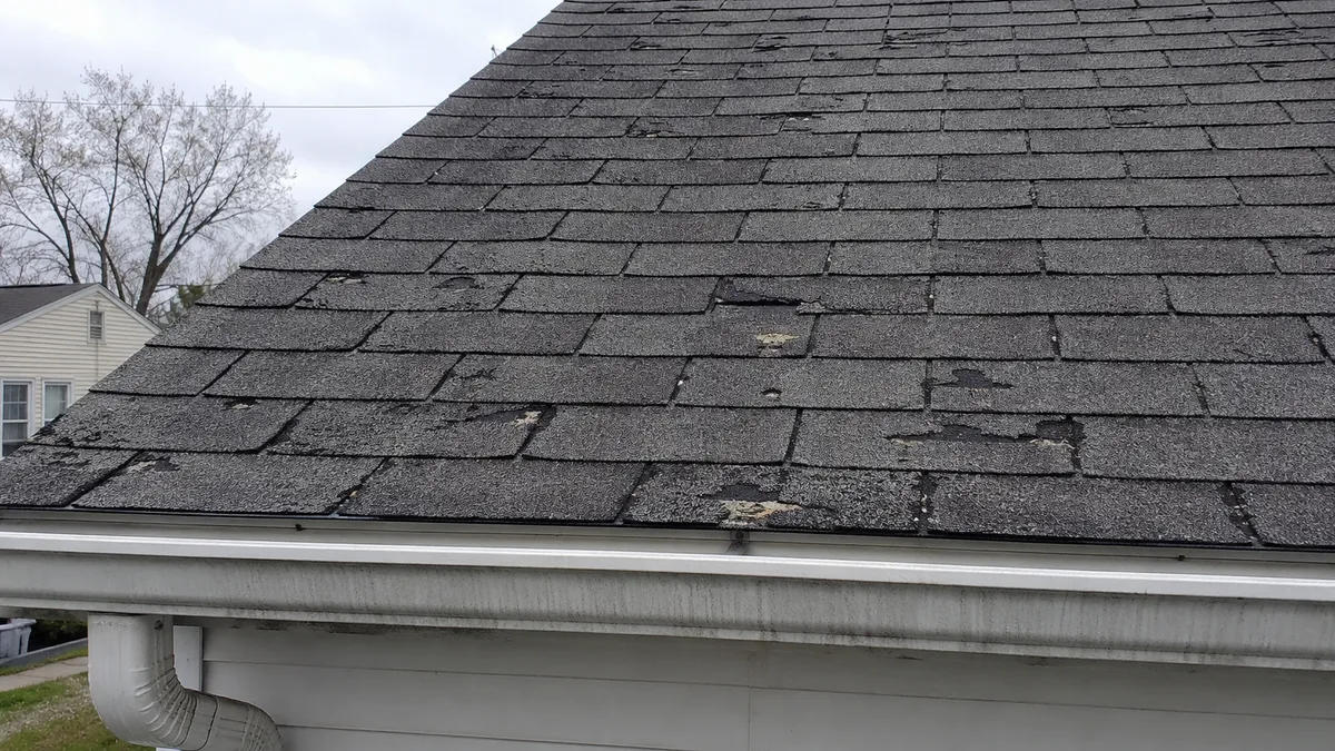 A worn asphalt shingle roof in Milwaukee showing signs of age