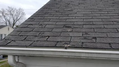 A worn asphalt shingle roof in Milwaukee showing signs of age