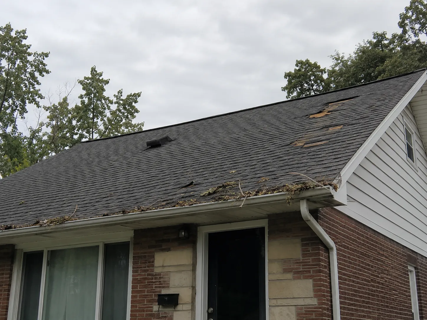 Documenting storm damage to a roof in Milwaukee before cleanup begins