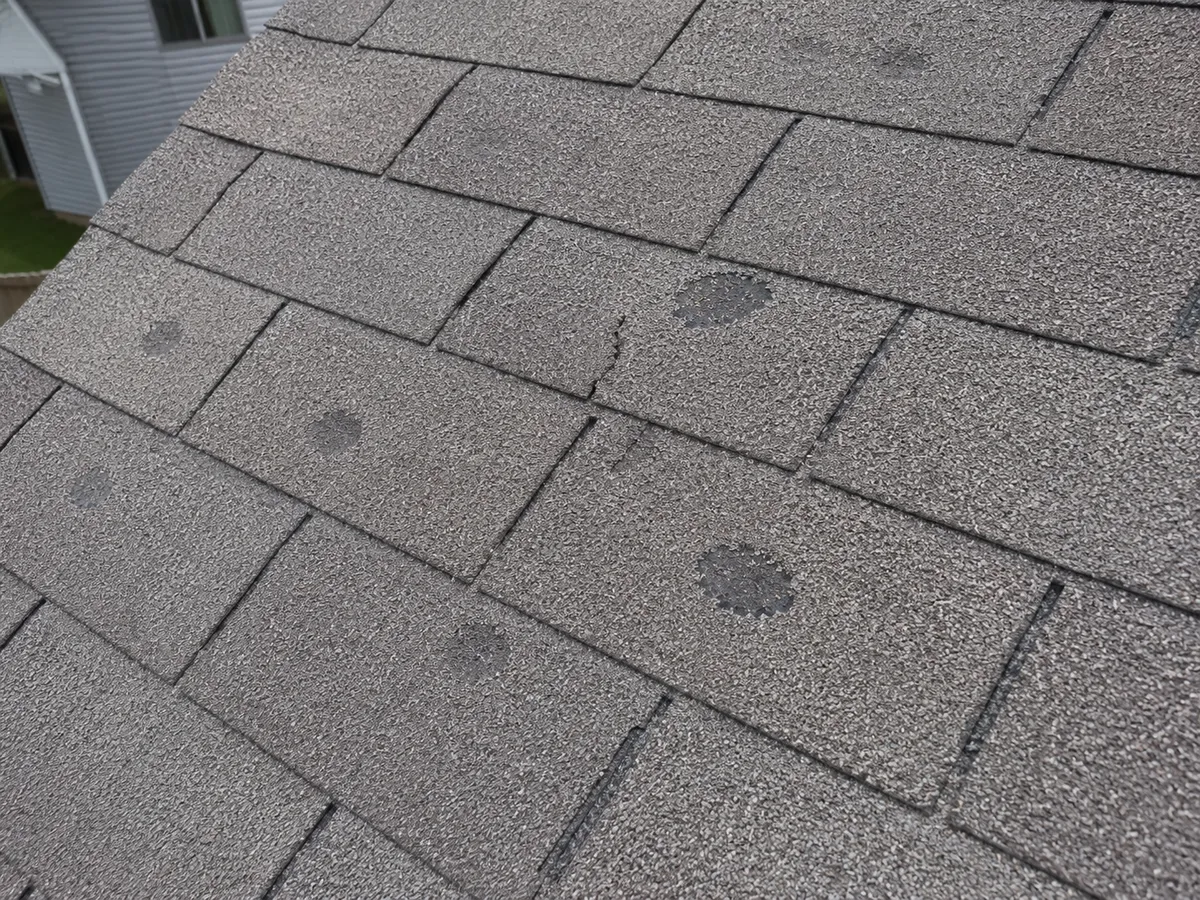 Hail damage on an asphalt shingle roof in the Milwaukee area